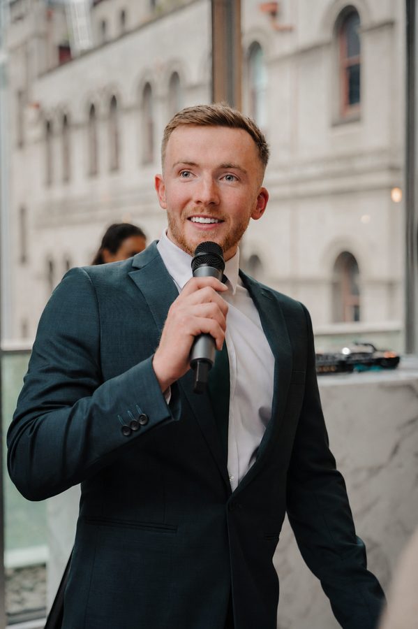 Tom on the mic as MC at a wedding